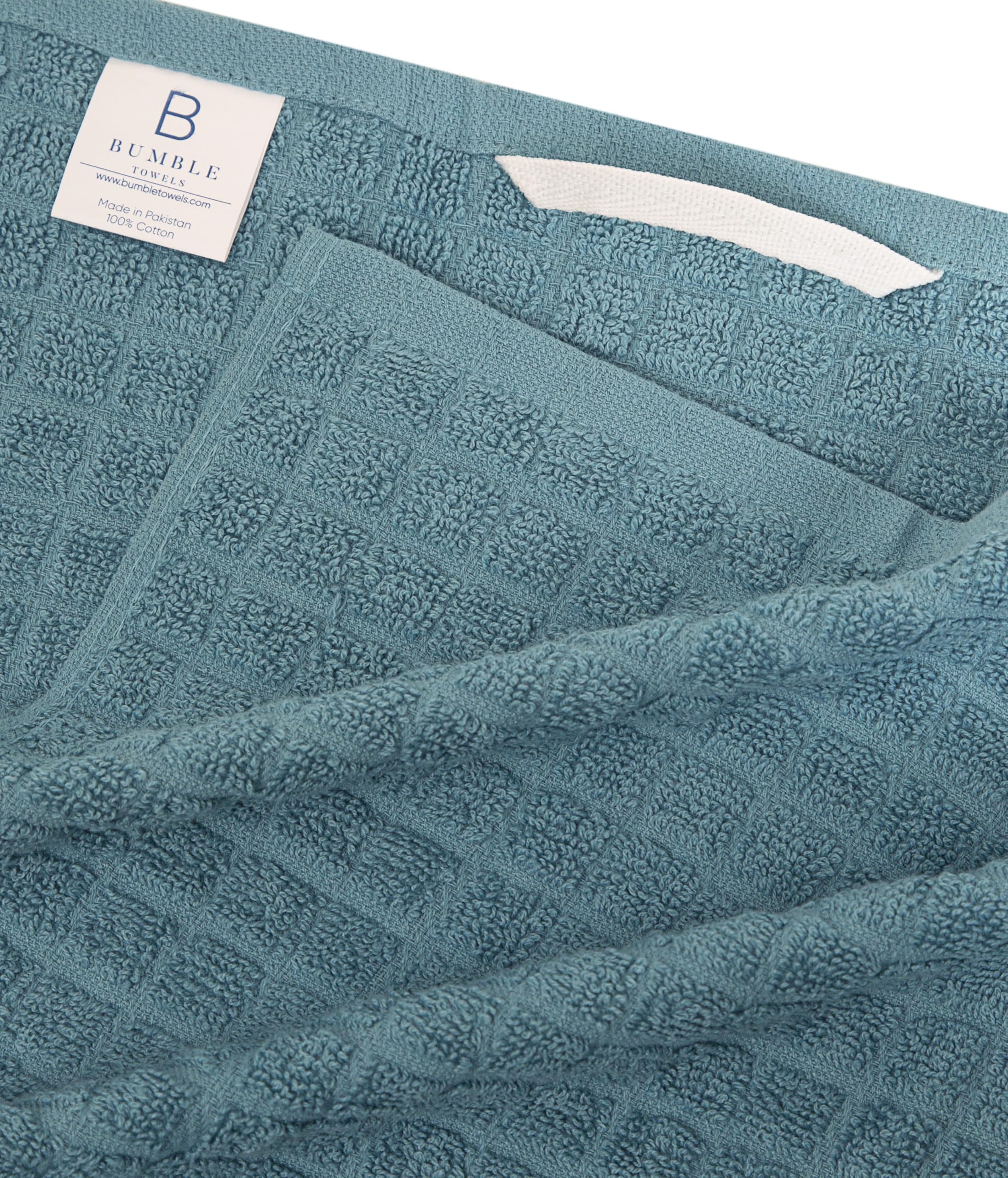 Bumble Towels hanging loop highlights easy air-drying and tidy storage.