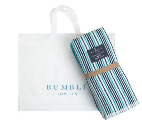 Bumble Towels aqua-colored towels brighten kitchen decor and add style.