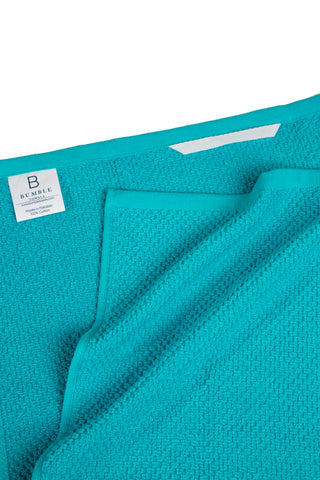 Bumble Towels hanging loop keeps towels handy on kitchen hooks and rails.