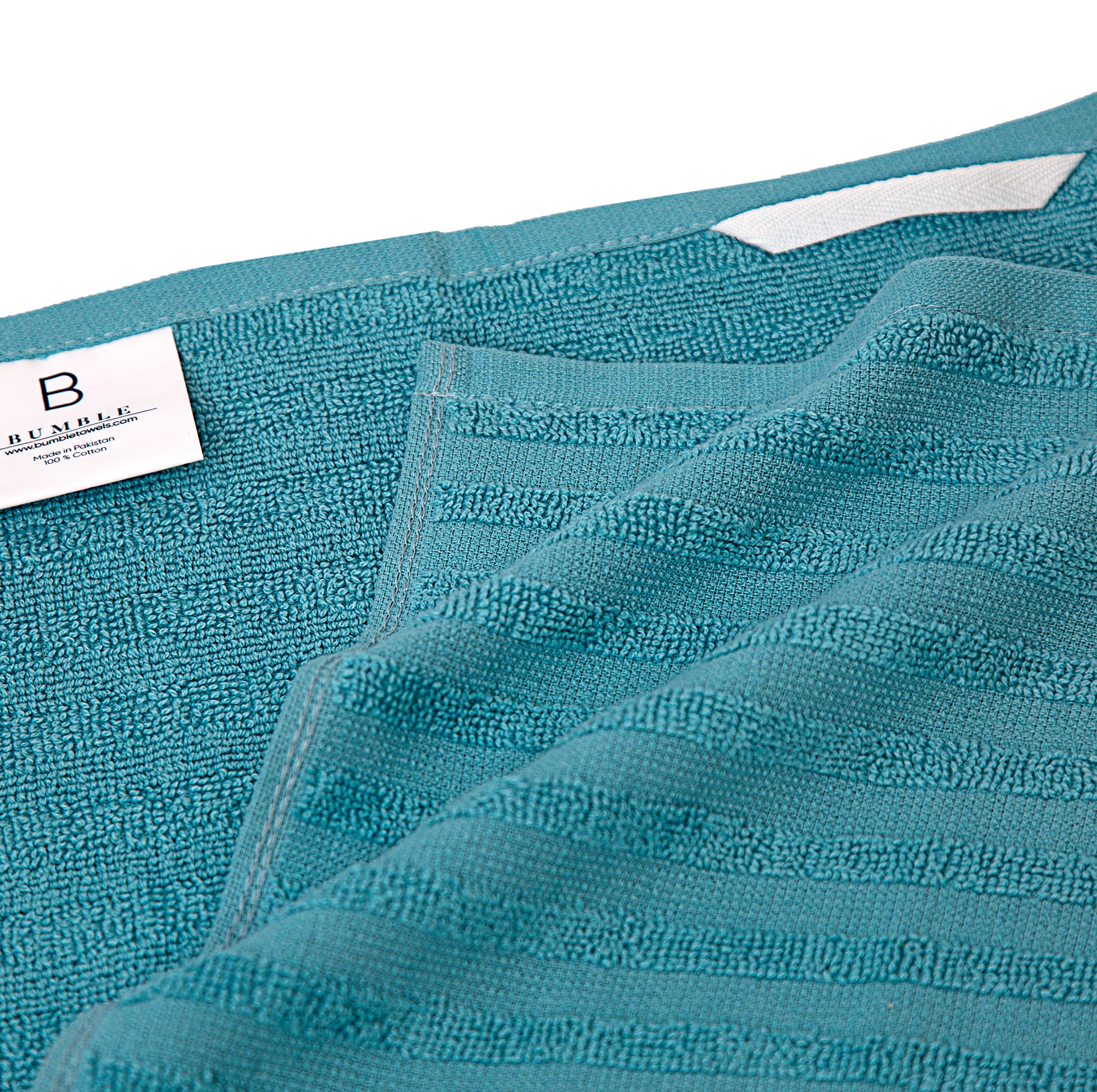 Towel with hanging loop from Bumble Towels for easy drying and access.