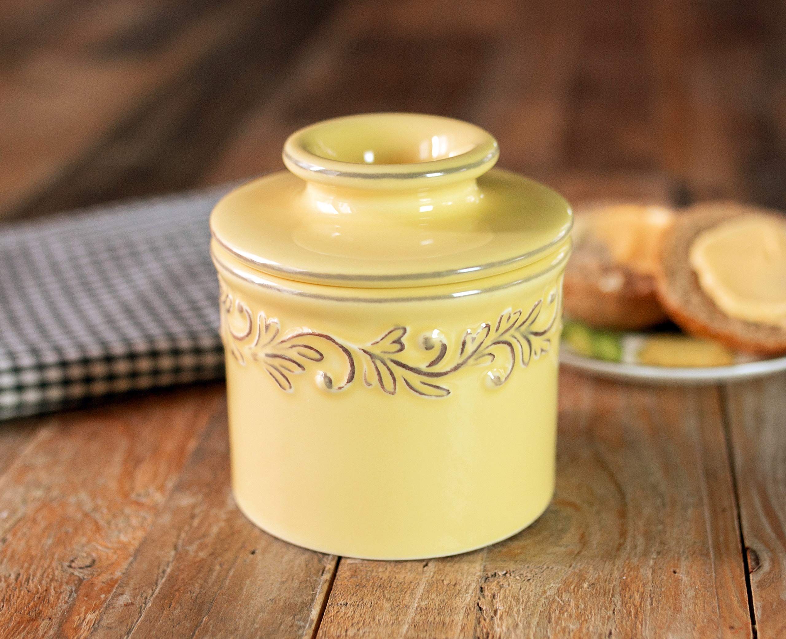 Butter Bell embossed vine leaves detail shows vintage Provencal charm.