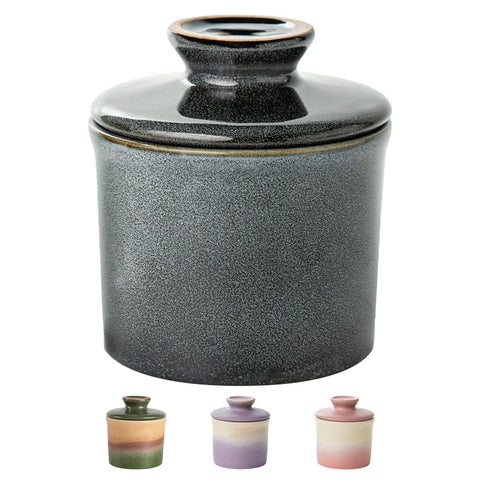 Butter crock with lid on countertop shows elegant ceramic design for fresh spreads.