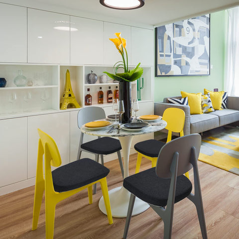 Four-pack BUYUE cushions arranged on chairs in a dining setup.