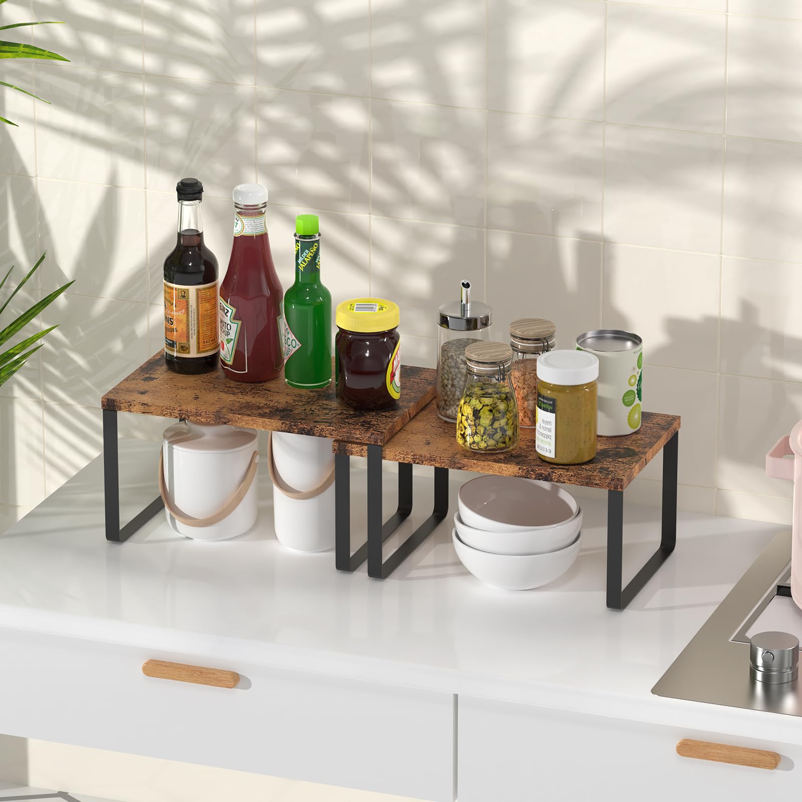 CADUKE expandable two-tier rack displayed on a kitchen counter for flexible storage.