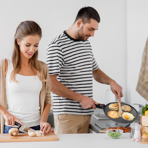 CAINFY pancake pan on gas stove shows reliable heat for even cooking.