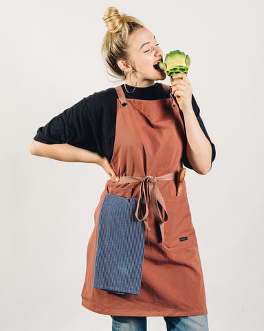 Caldo Crossback Apron crossback design distributes weight for shoulder comfort while cooking.