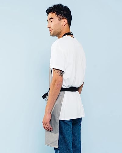 Caldo grey apron close up on durable stitching and hardware details