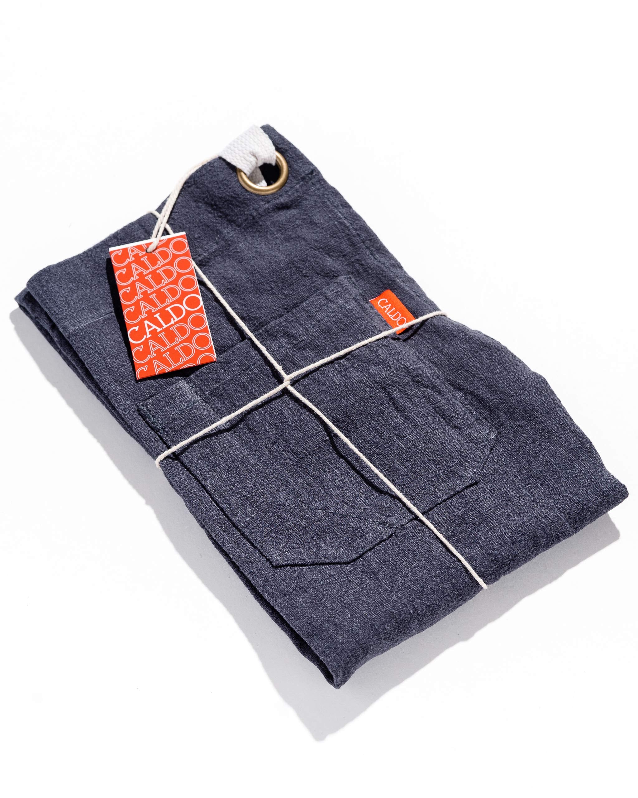 Caldo apron fabric texture, emphasizing 90% linen for natural resilience