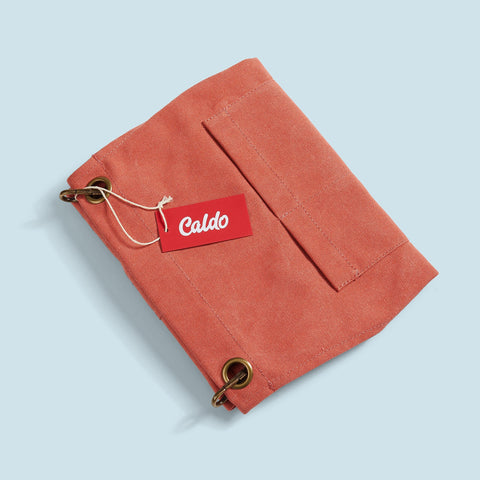 Caldo terracotta apron worn in a workshop demonstrates practical use