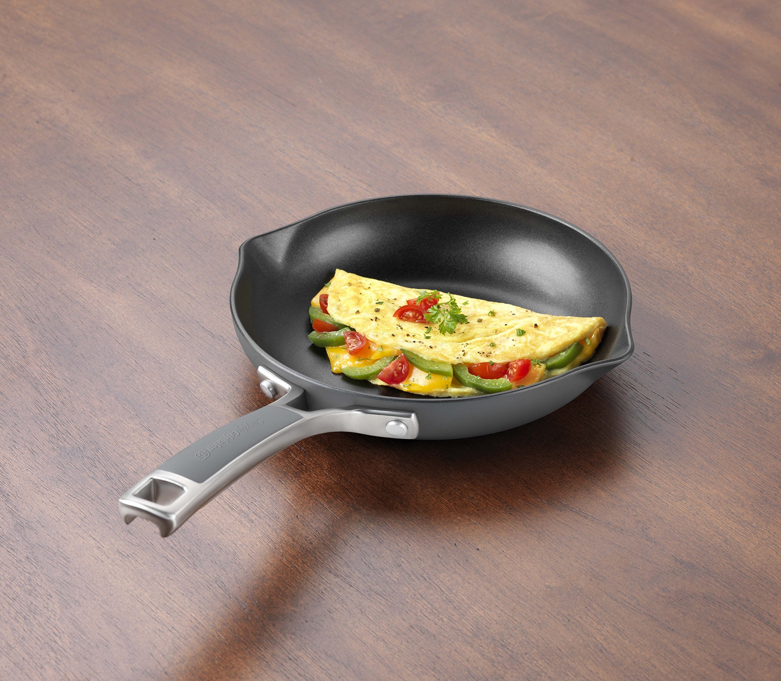 Calphalon Easy System 8in omelette pan with silicone handle for a cool, secure grip.