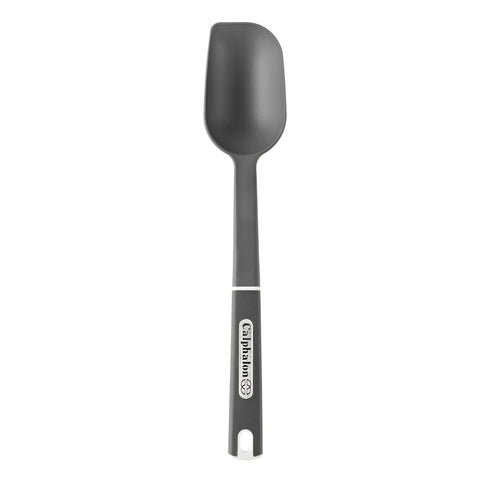 Calphalon nylon solid spoon large in use, scraping and stirring safely, heat resistant up to 400°F