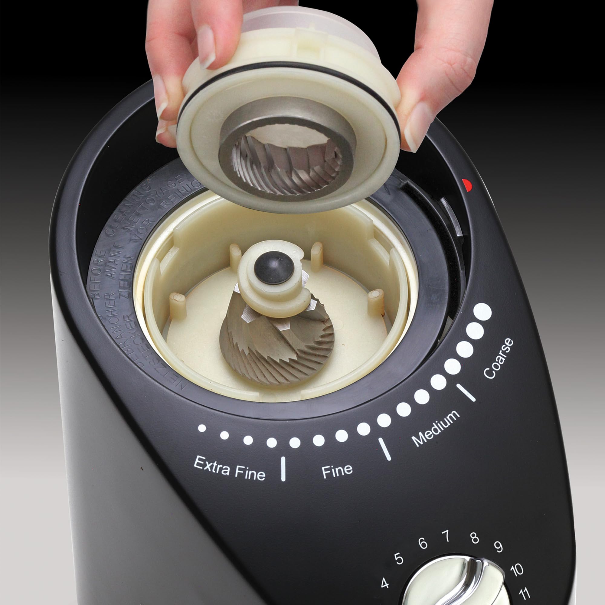 Capresso Infinity Plus in Black on a modern kitchen counter, compact and quiet.