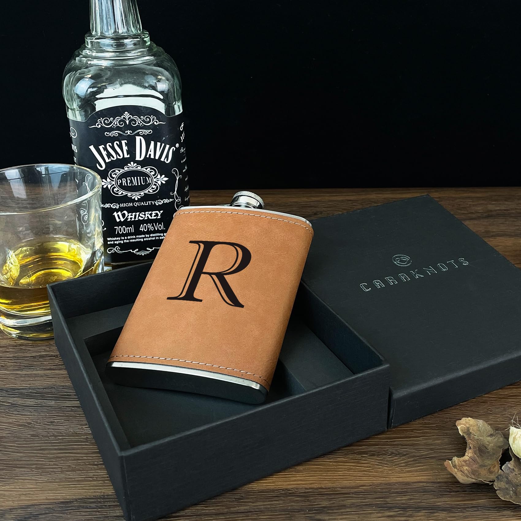 CARAKNOTS stainless steel hip flask, 8 oz, durable and secure.