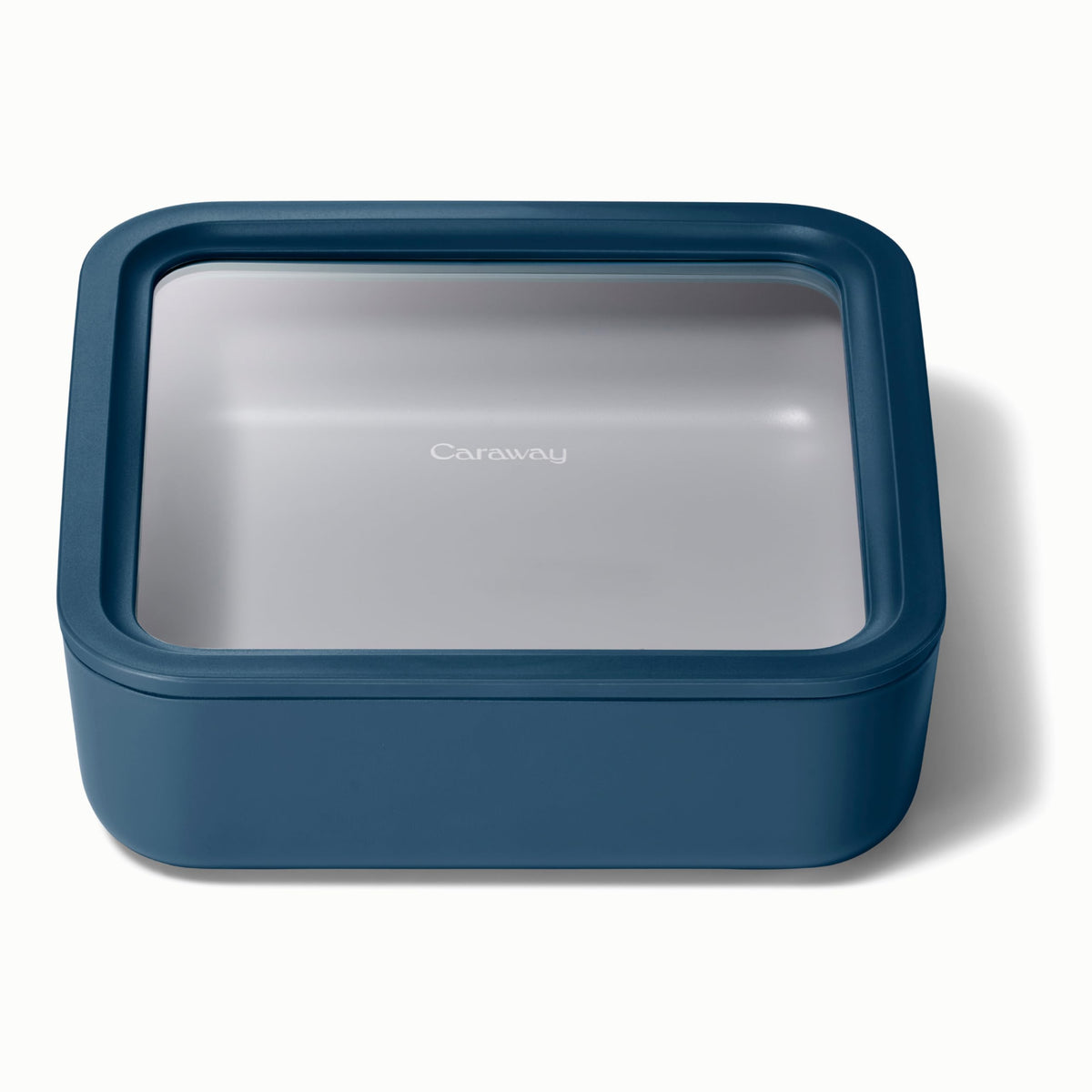 Caraway glass storage 10-cup container with airtight seal preserves leftovers.