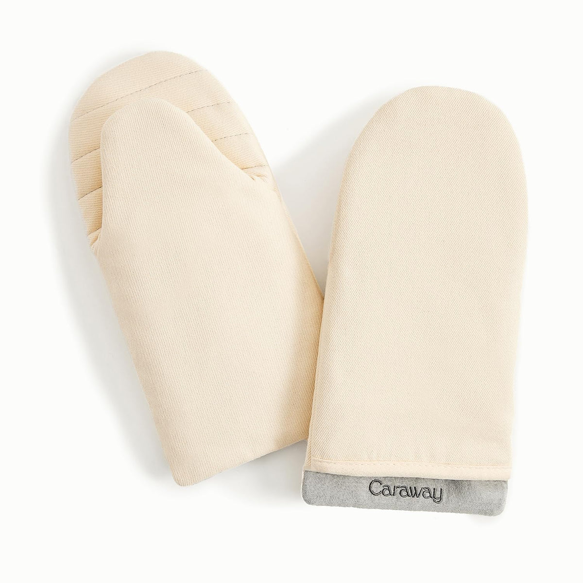 Caraway oven mitts cream close-up shows double-layer stitching for secure grip.