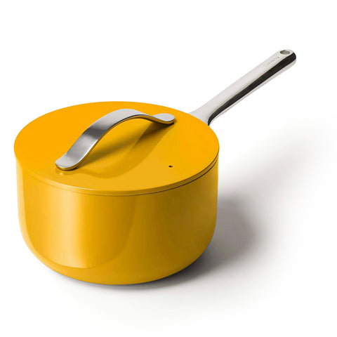 Caraway 3 qt sauce pan with marigold lid on for effortless nonstick cooking.