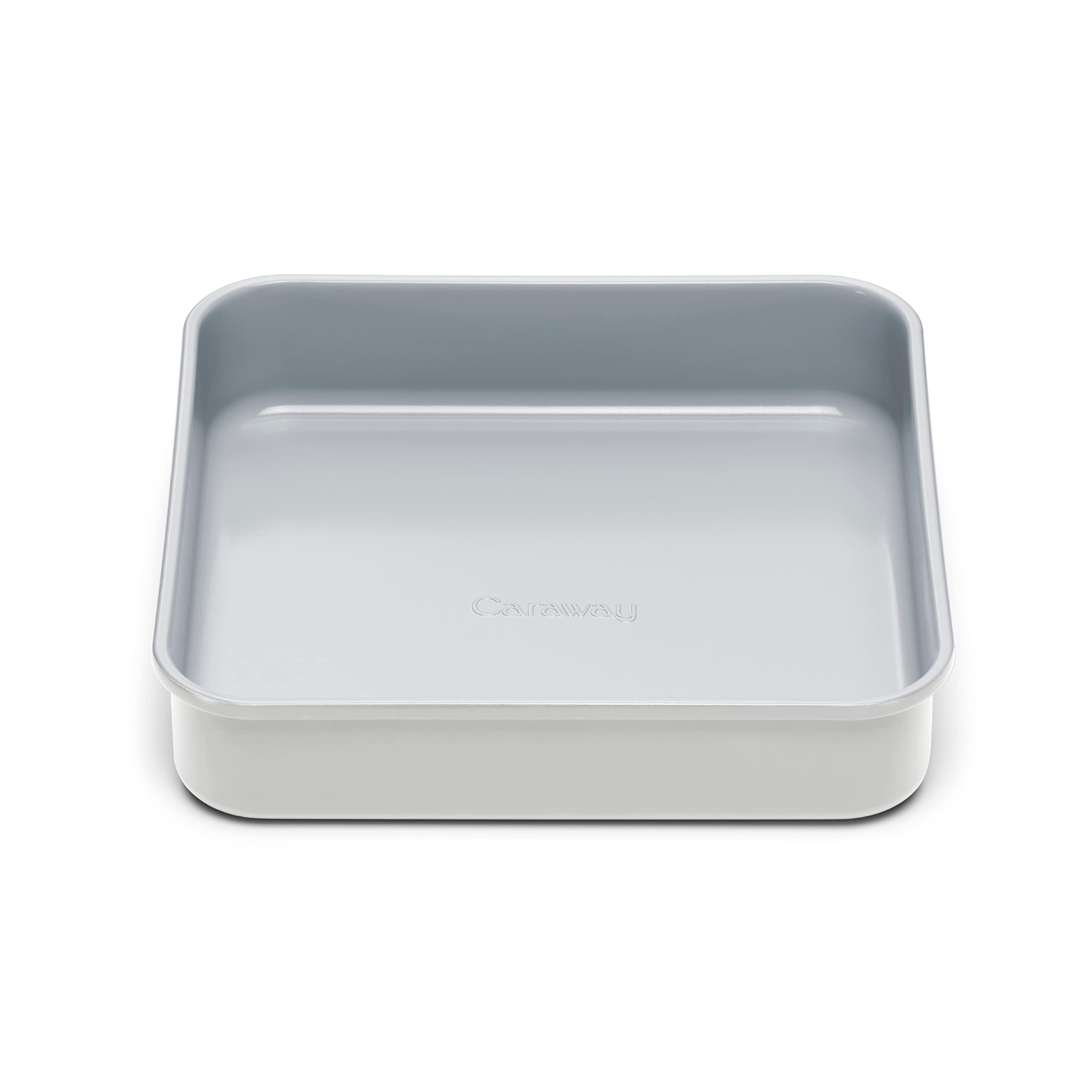 Caraway 9-inch square pan releasing fudgy brownies with the ceramic non-stick coating.