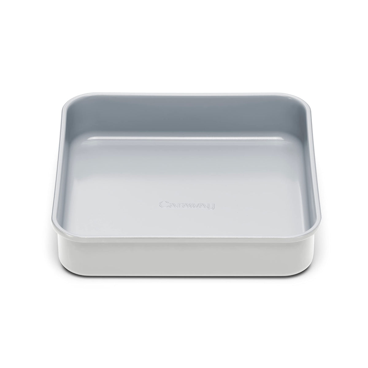 Caraway 9-inch square pan releasing fudgy brownies with the ceramic non-stick coating.