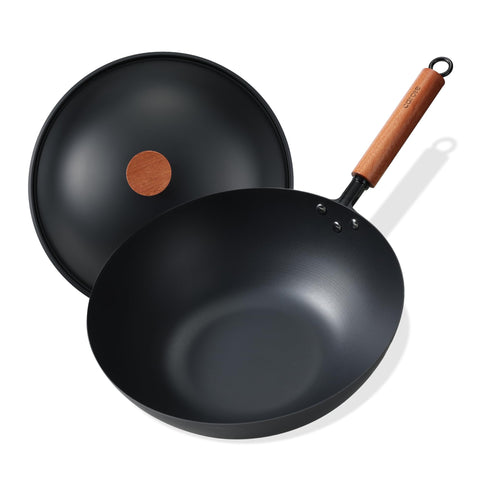 CAROTE 12-inch carbon steel wok pan handle close-up for secure grip during high-heat stir-fry.
