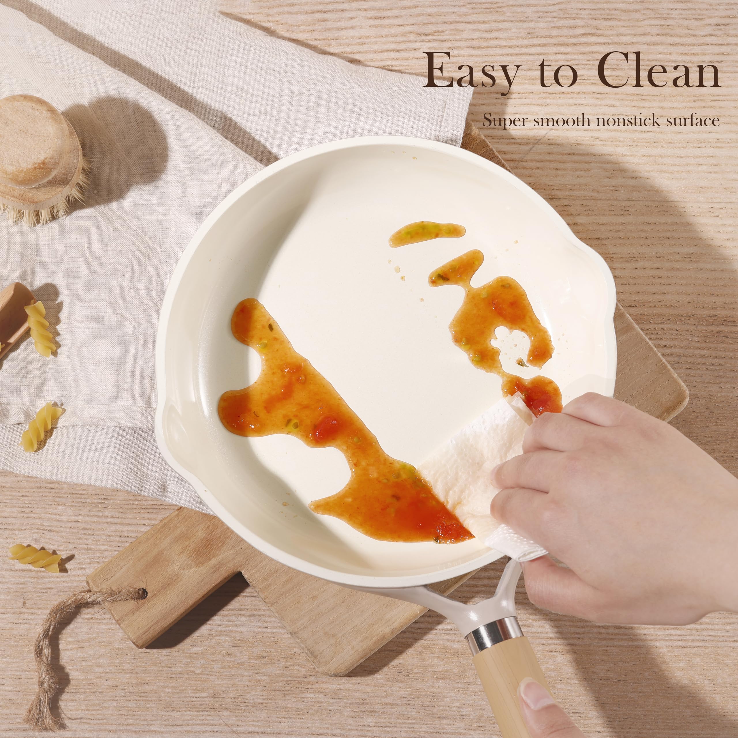 CAROTE ceramic-pan on stove with sizzling sauté.