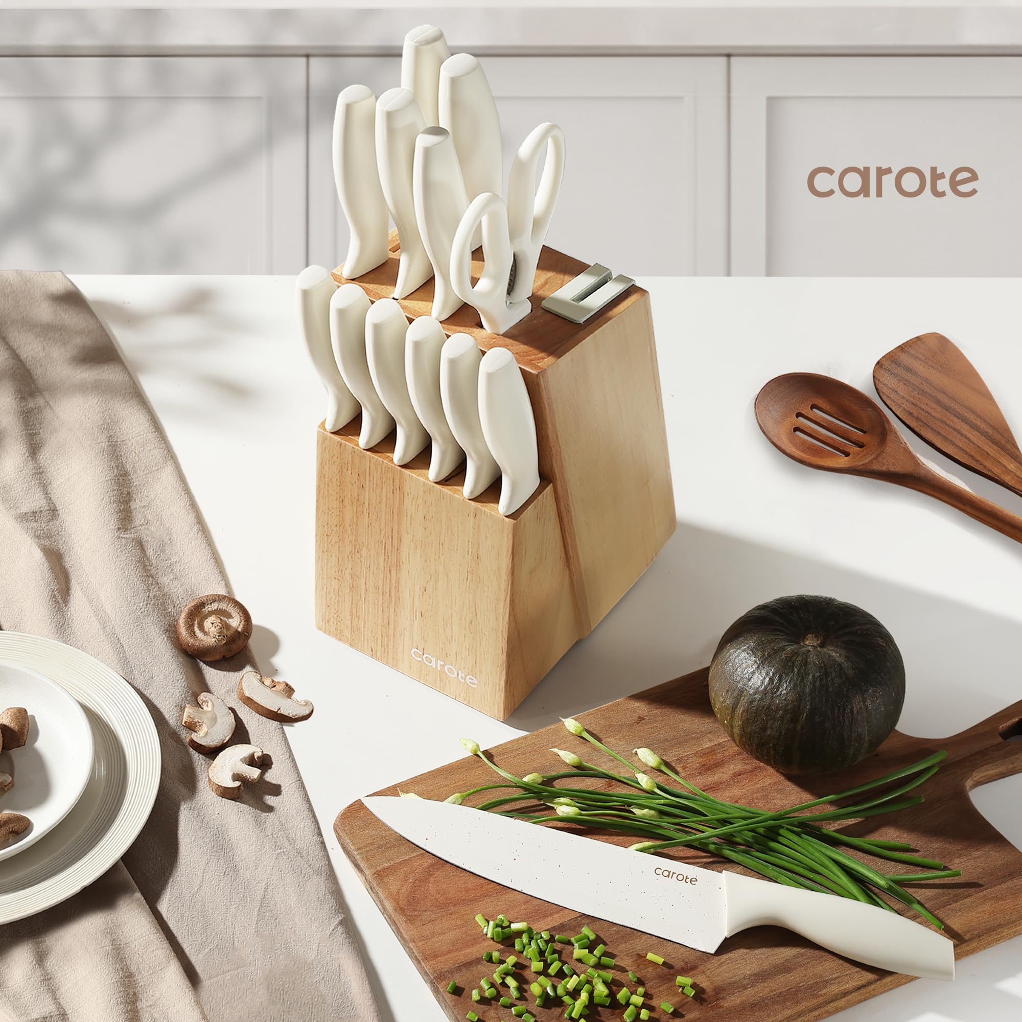 CAROTE modern kitchen display emphasizes sleek white blades and wooden block