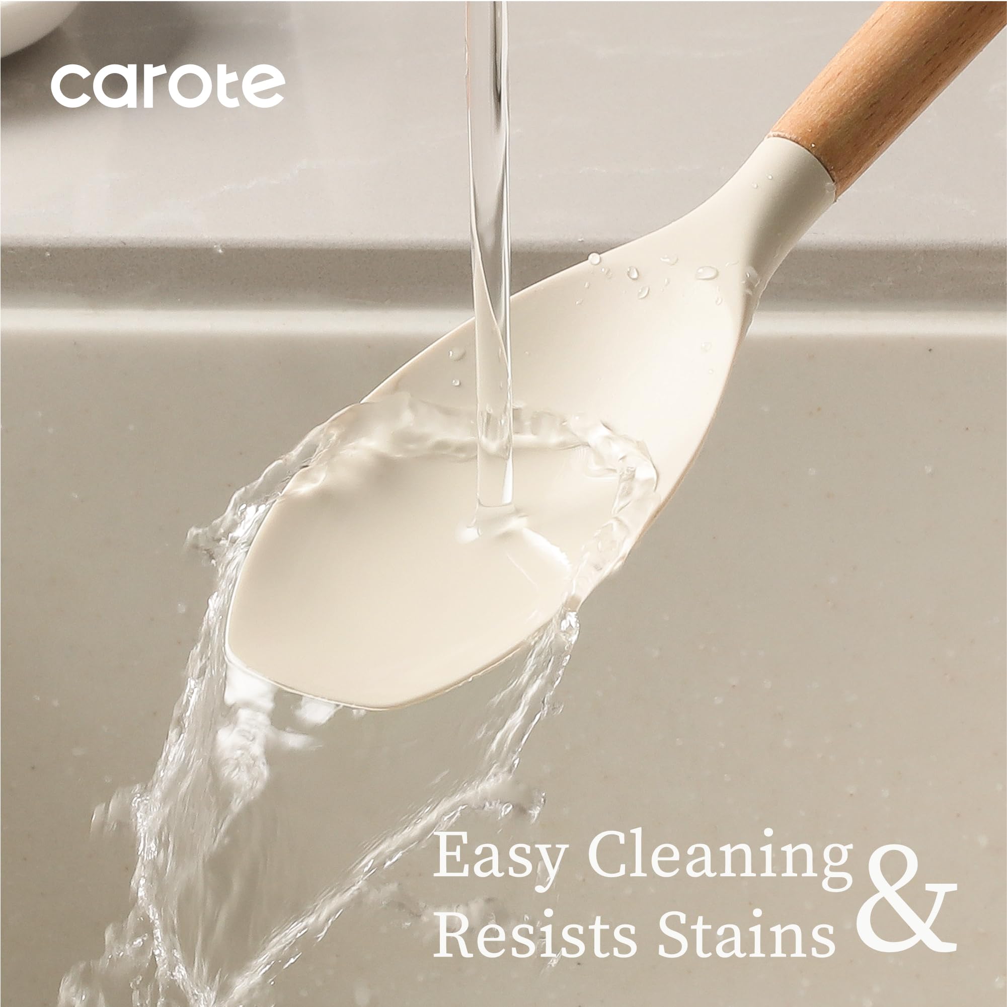 CAROTE silicone-slotted spatula in cream for draining while cooking.