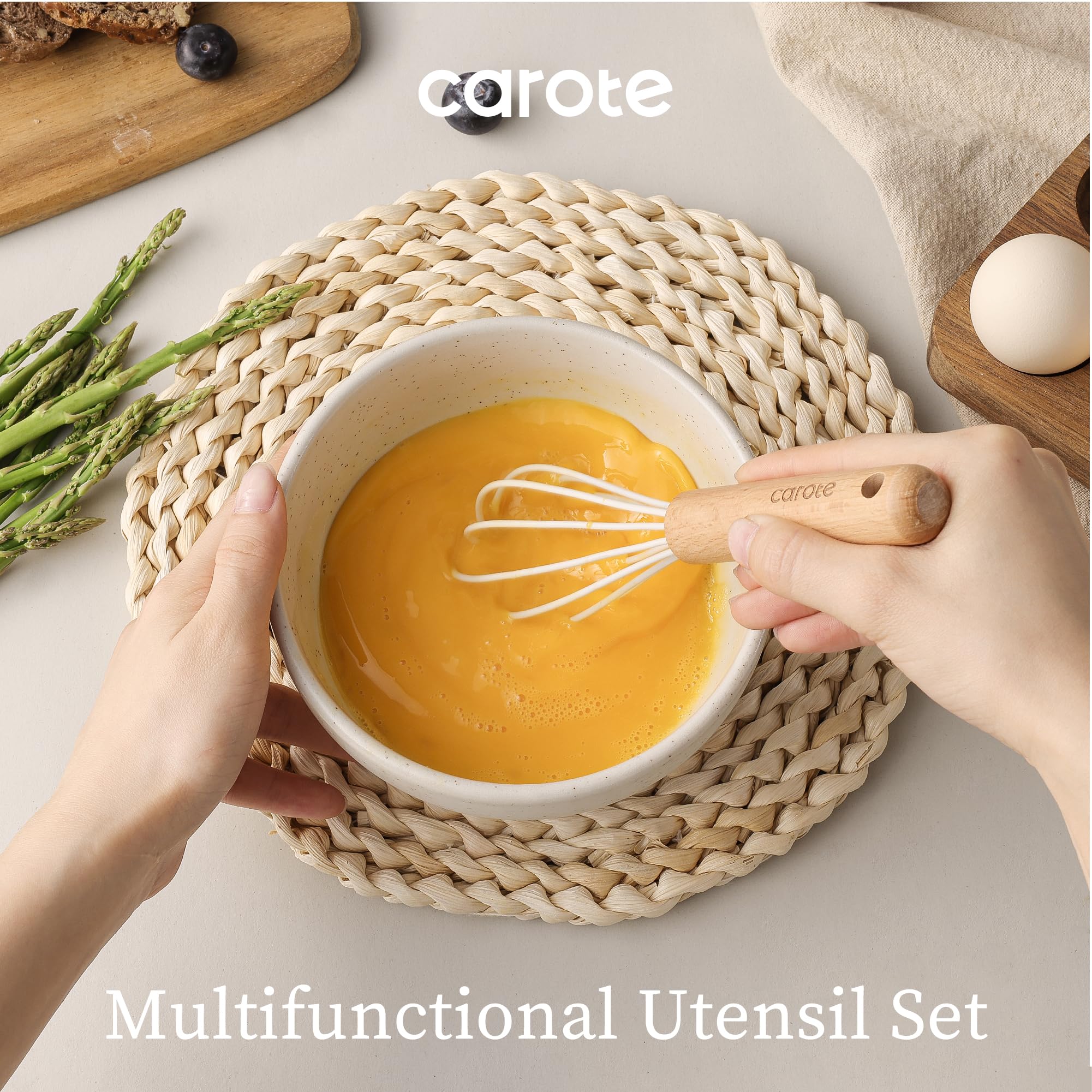 CAROTE solid silicone spatula in cream for sturdy scraping.