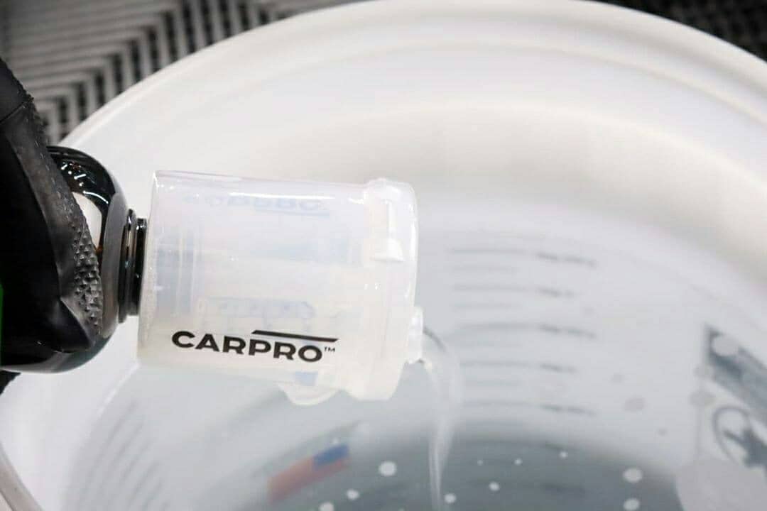 CARPRO Measure dilution-in-action demonstrates practical use during car detailing.