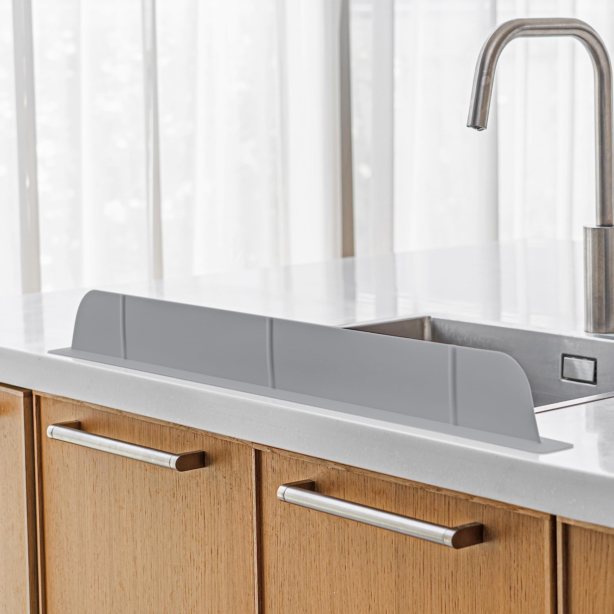 Casa Starlet ultra-wide splash guard covers 30 inches to protect clothes during busy dishwashing.