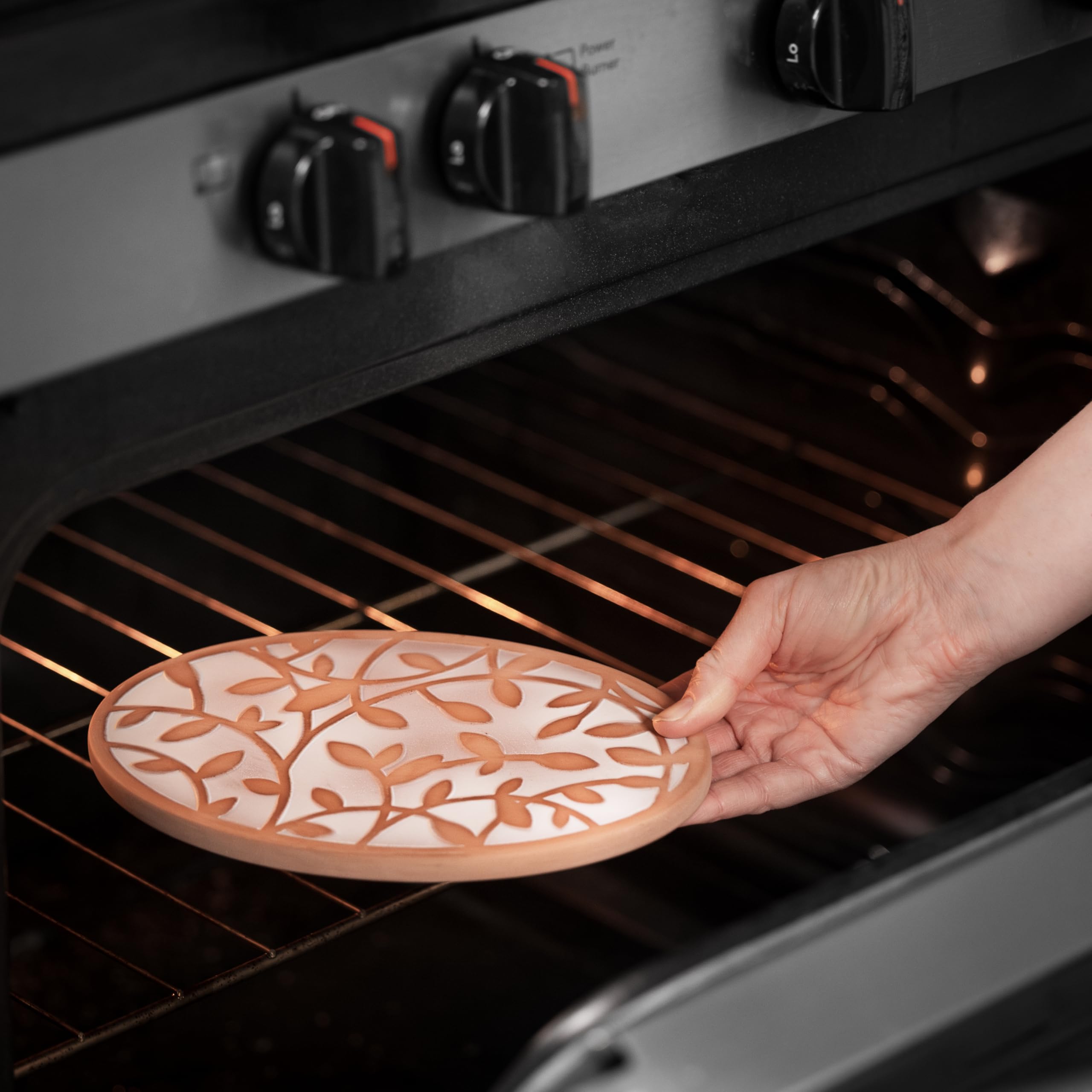 CASADEMA terracotta-warming-stone maintains warmth during service.