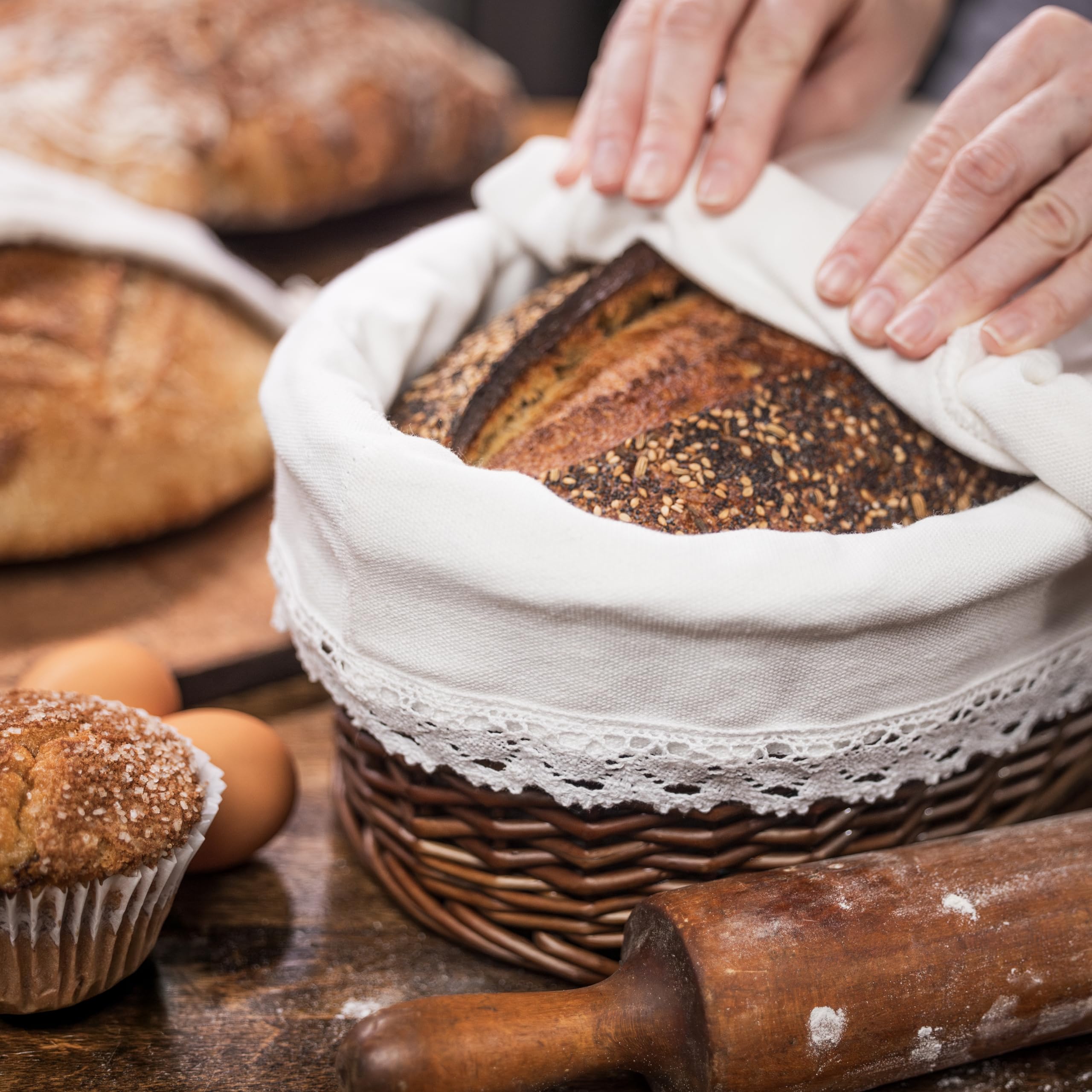 CASADEMA willow-basket-with-lid displays warm bread elegantly on the table.