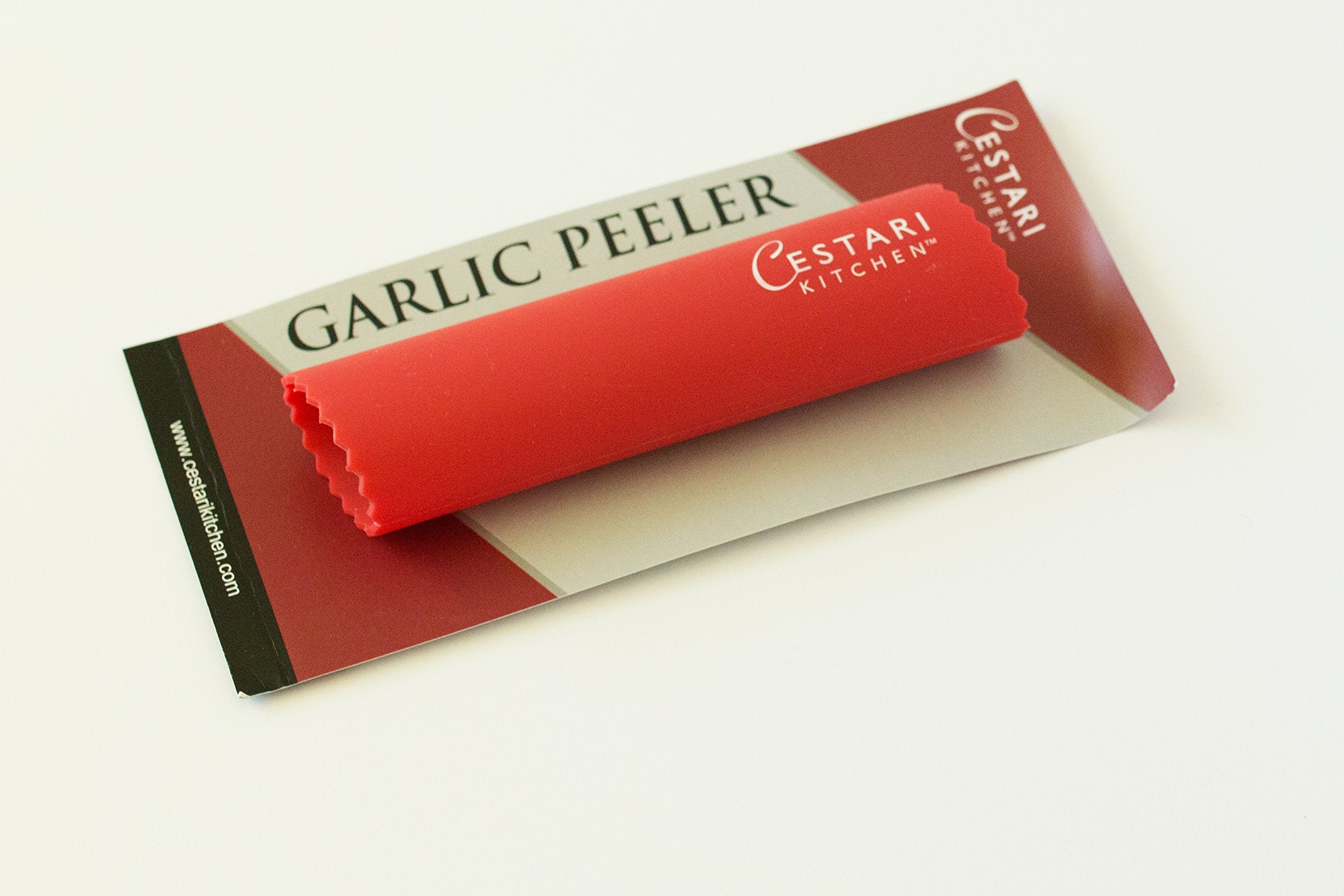 Red version of Cestari garlic peeler roller ready for busy cooks
