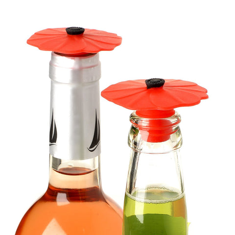 Charles Viancin Poppy bottle stopper 2-pack on bottle prevents oxidation and leaks.