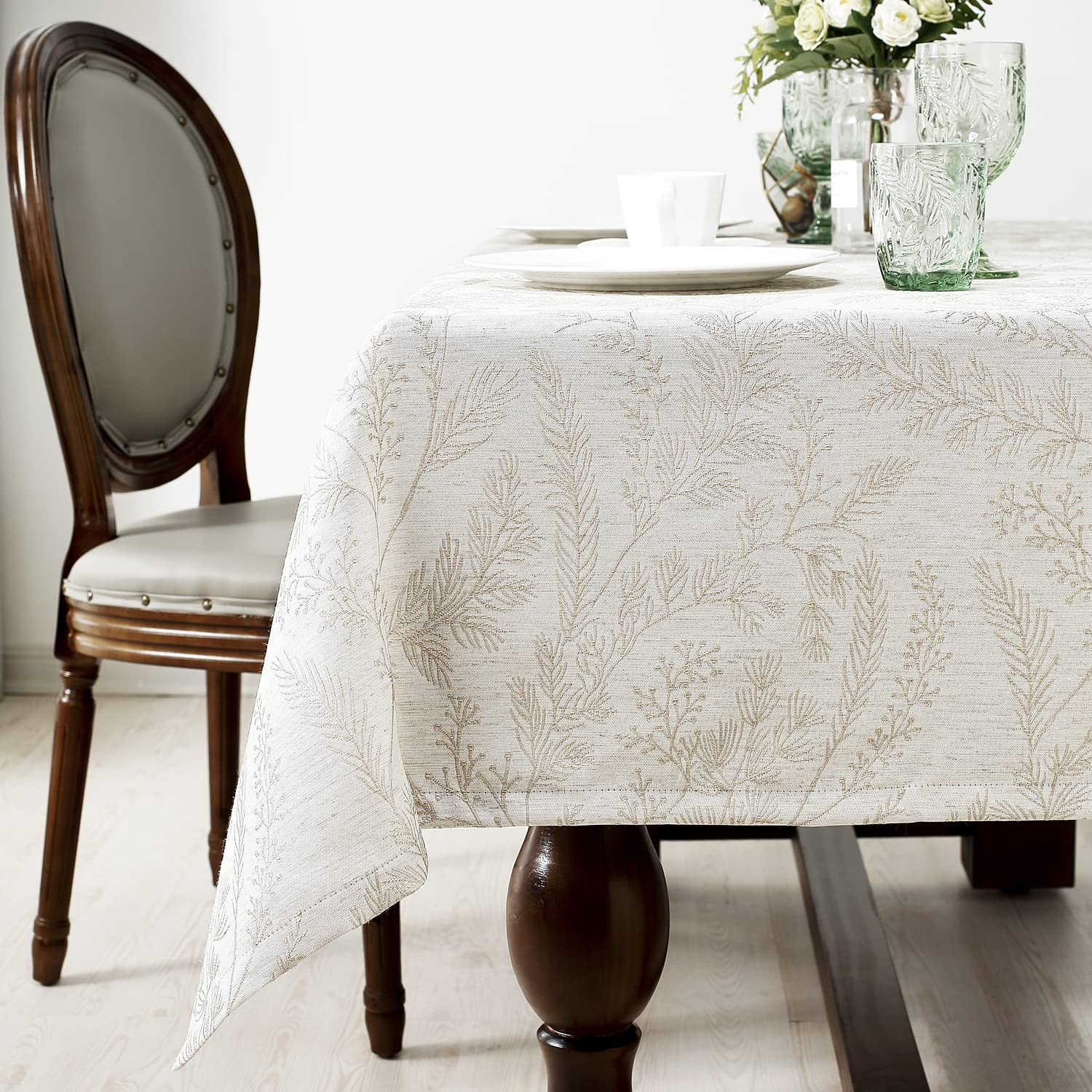 Chassic damask tablecloth in cream appears wrinkle-free after setup.