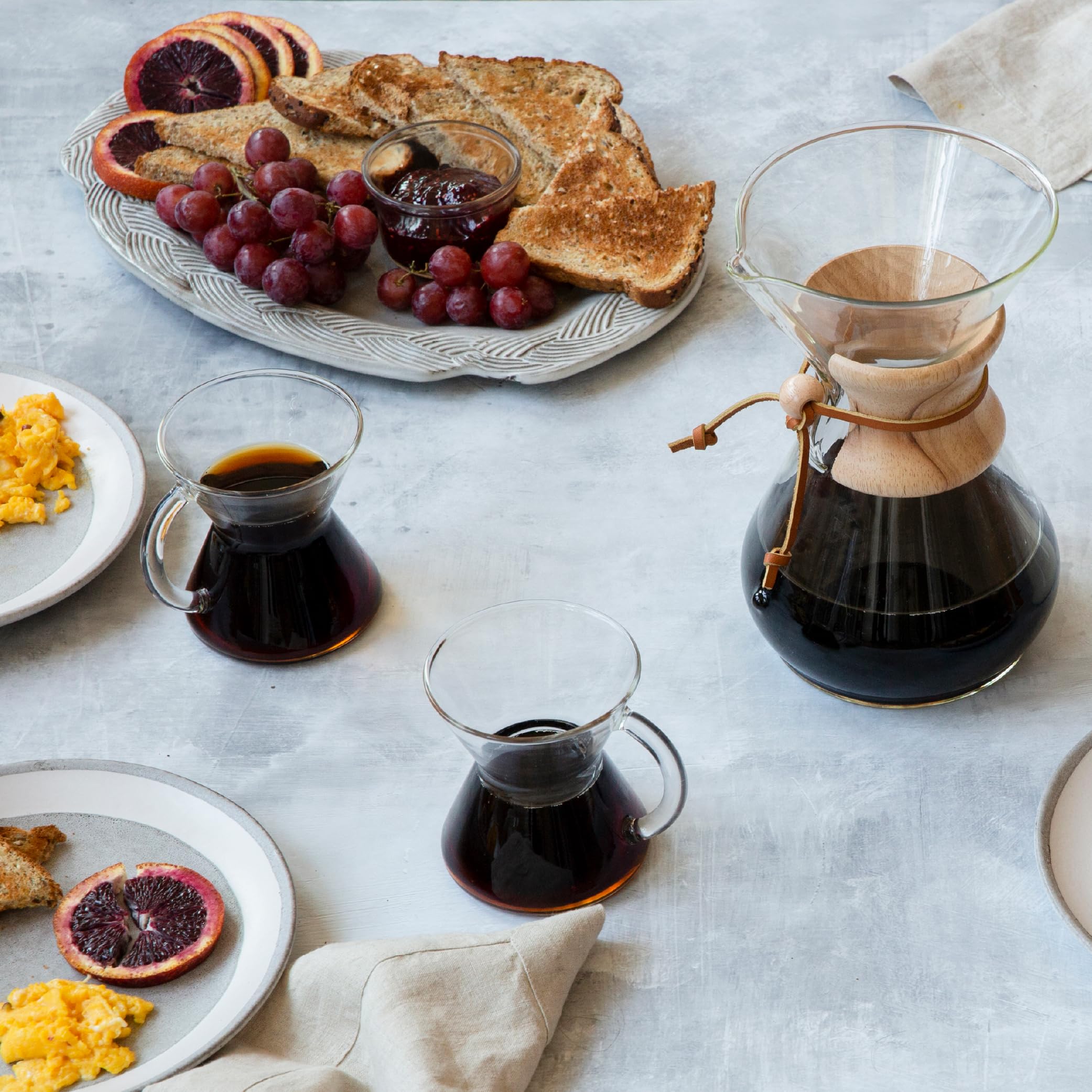 Chemex mug with coffee steam highlights non-porous glass preserves flavor.