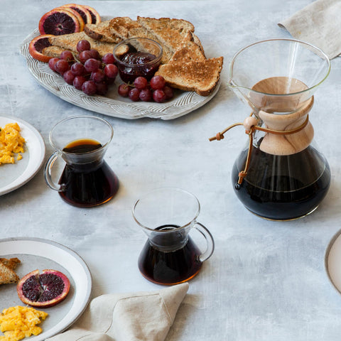 Chemex mug with coffee steam highlights non-porous glass preserves flavor.