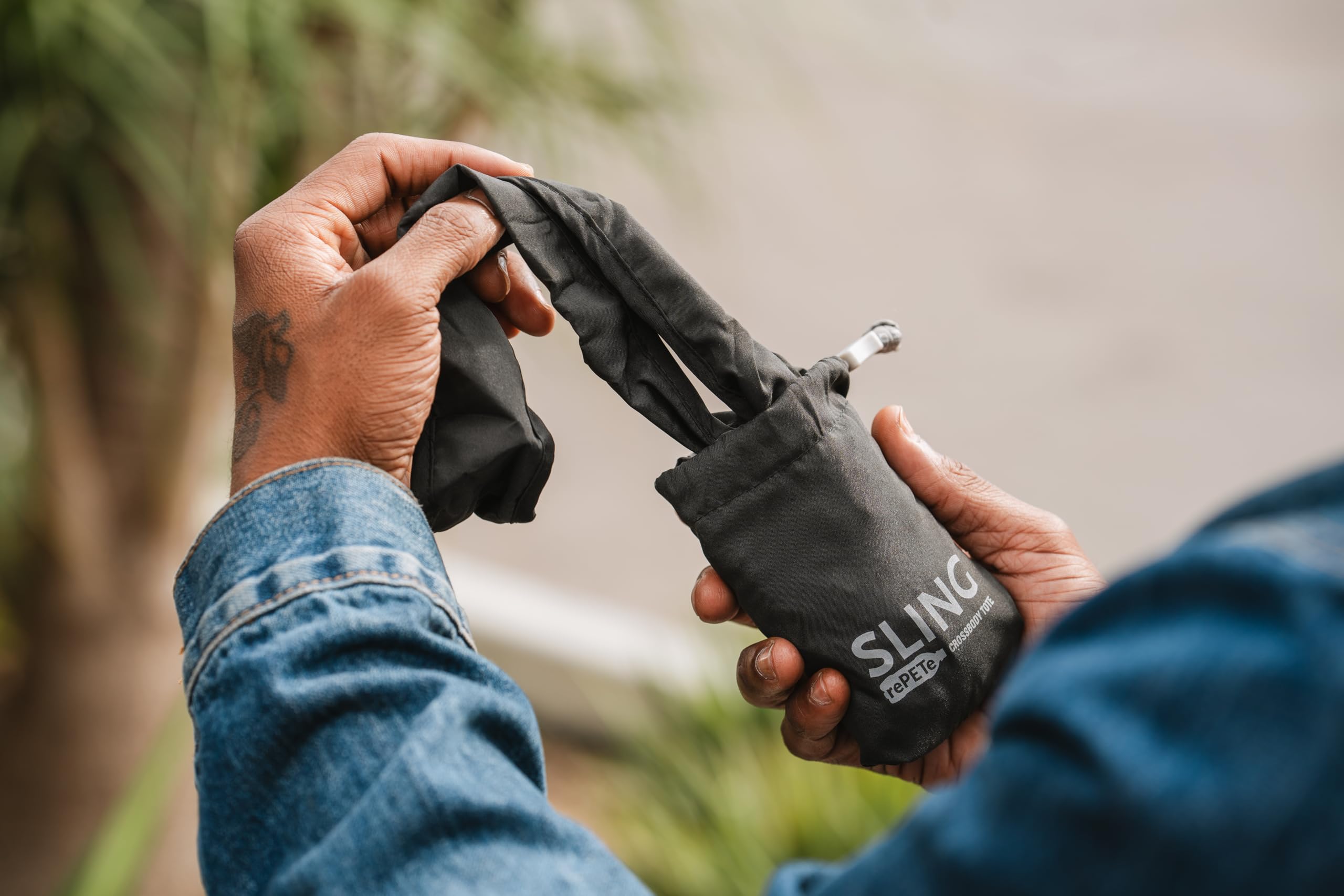 ChicoBag Sling rePETe Refine sage bag highlights eco mission and certifications