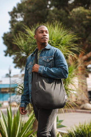 ChicoBag Sling rePETe Refine sage bag on bike for commuting