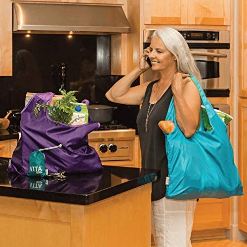 ChicoBag Vita tote being clipped to bag or hook for easy access.