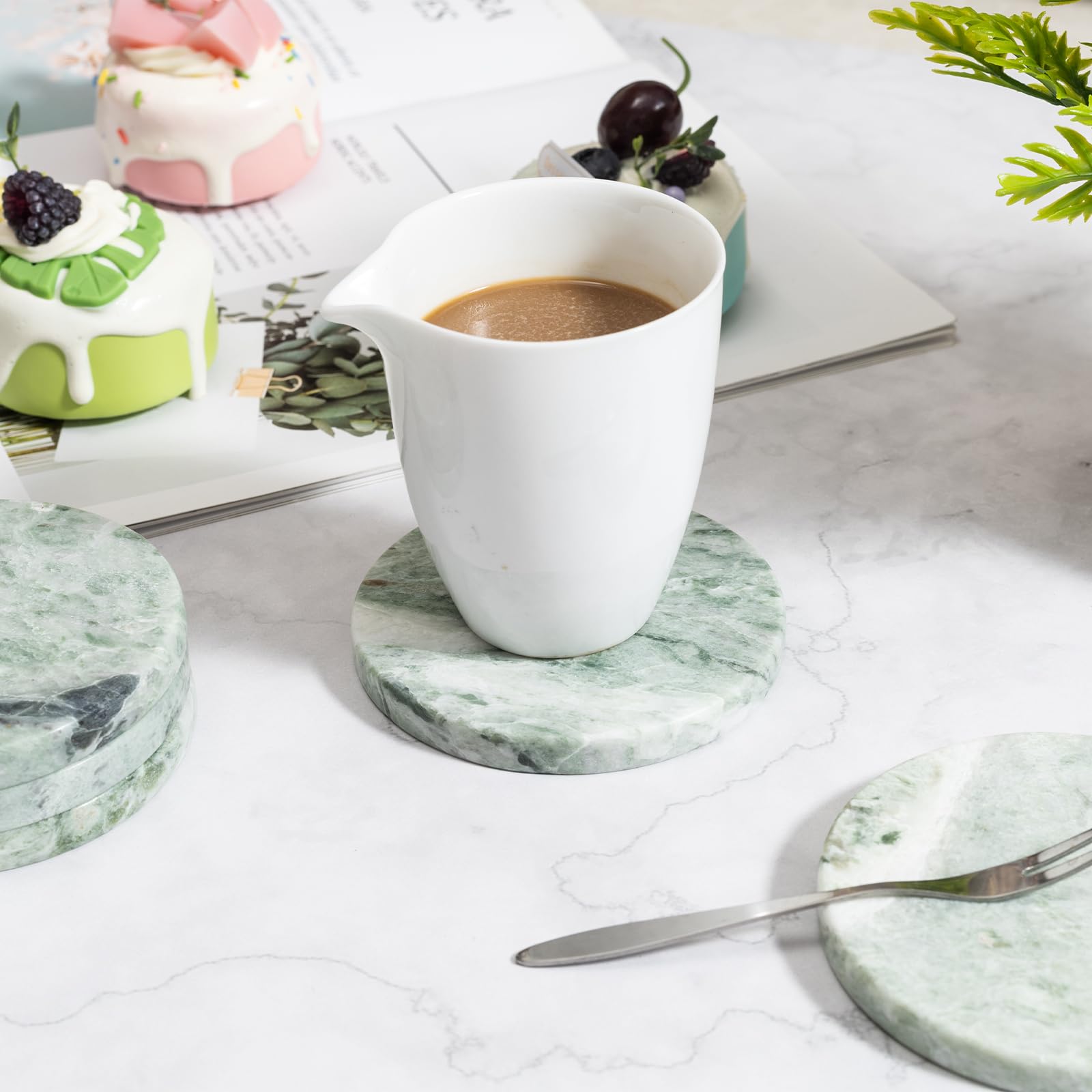 CHISELED ST DF SK green marble coaster on a glossy surface protects against heat.