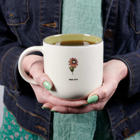 Close-up of pink and white flowers on the mug