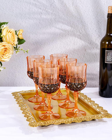 Ciaell amber plastic wine glass holding wine for festive toasts