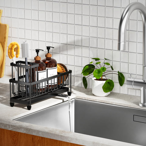 Cisily holds soap dispensers and kitchen tools neatly beside the sink.