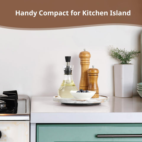 CMLKLZD wood lazy susan on a kitchen counter organizes spices and napkins.