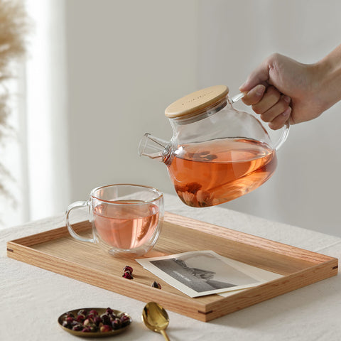 CNGLASS view of blooming tea infusion inside the glass teapot.