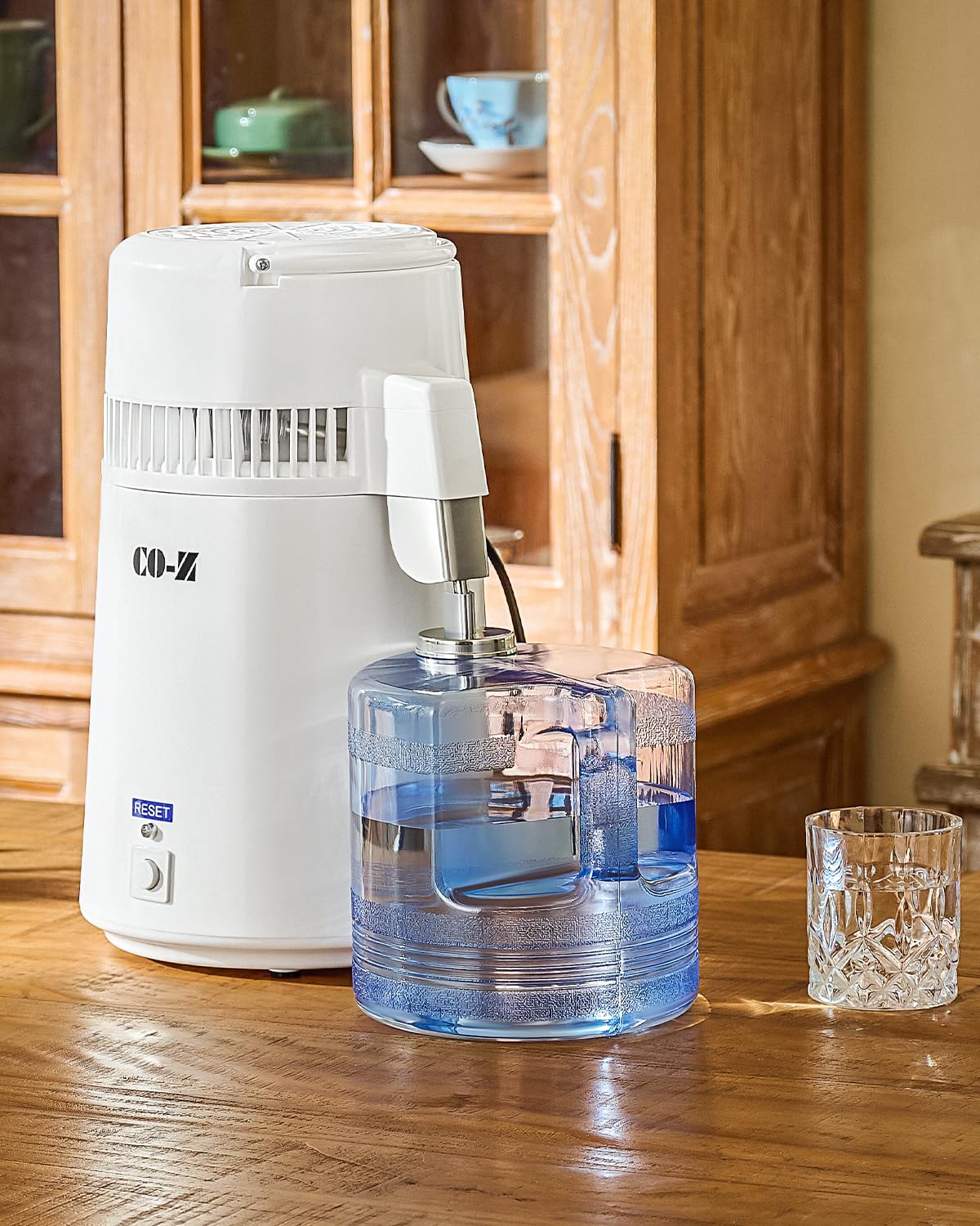 CO-Z cleaning powder pack shown for easy maintenance of the distiller.