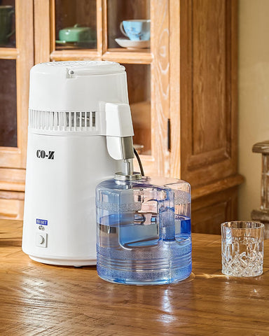 CO-Z cleaning powder pack shown for easy maintenance of the distiller.
