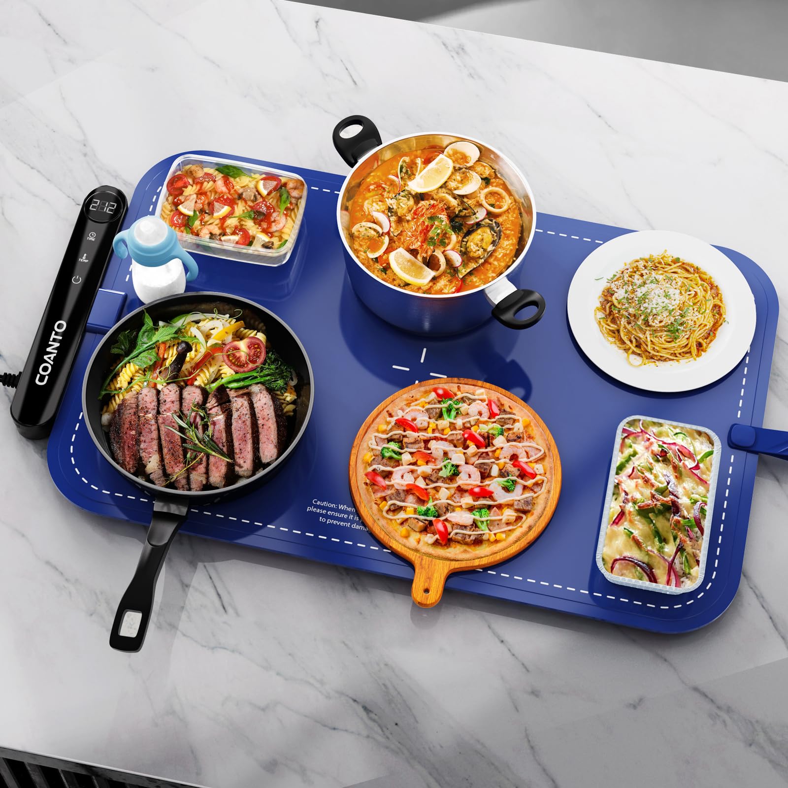 Coanto warming mat in action on buffet setup delivering even heat across a large surface.