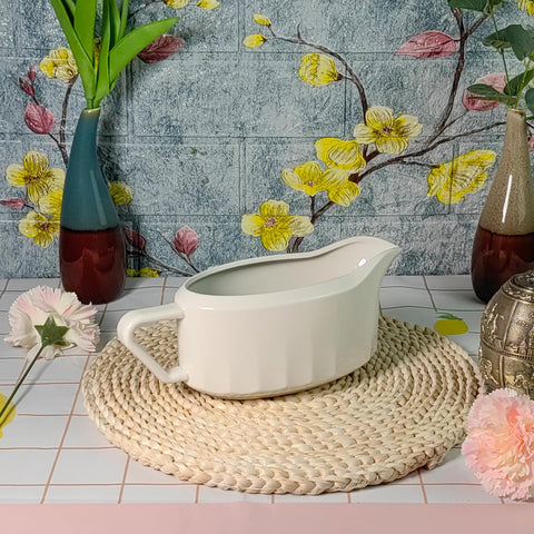 Cobata versatile gravy boat works for gravies, dressings, and dessert sauces.
