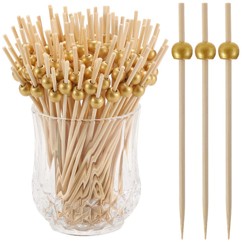 CockStixs elegant gold picks elevate table styling for parties and events.